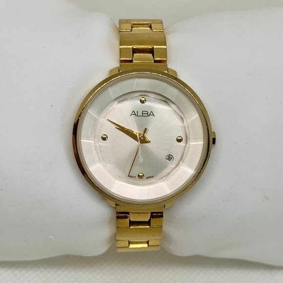 Alba gold tone women date watch 28mm analog fits a small wrist size 5” running - Picture 1 of 7